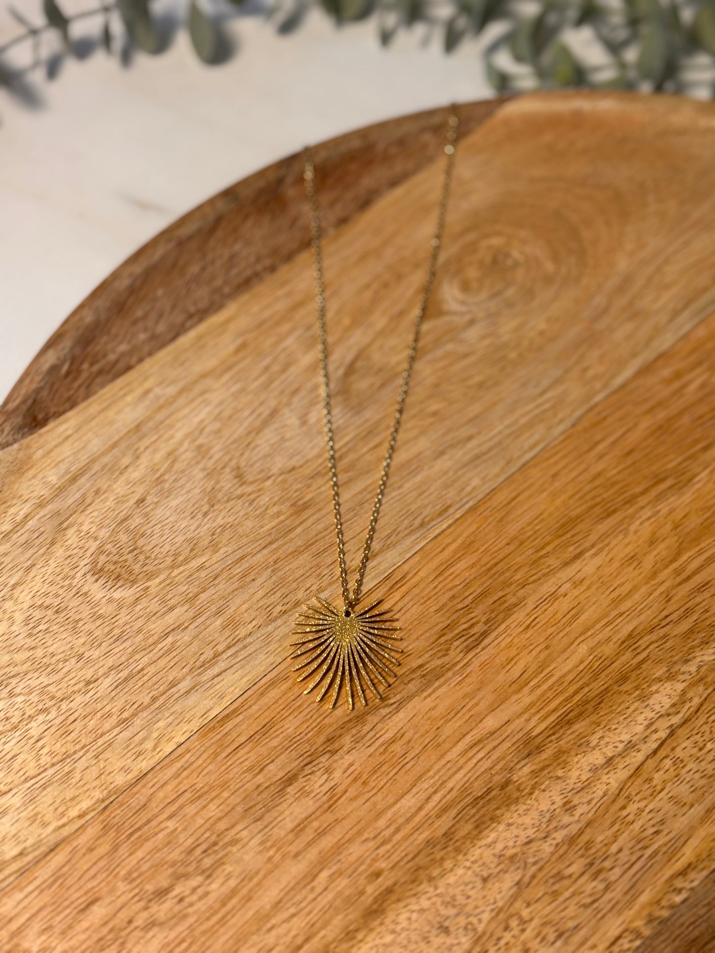 Gold palm leaf necklace
