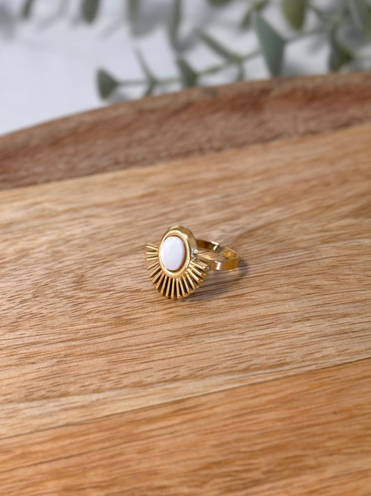 Gold ring with white stone