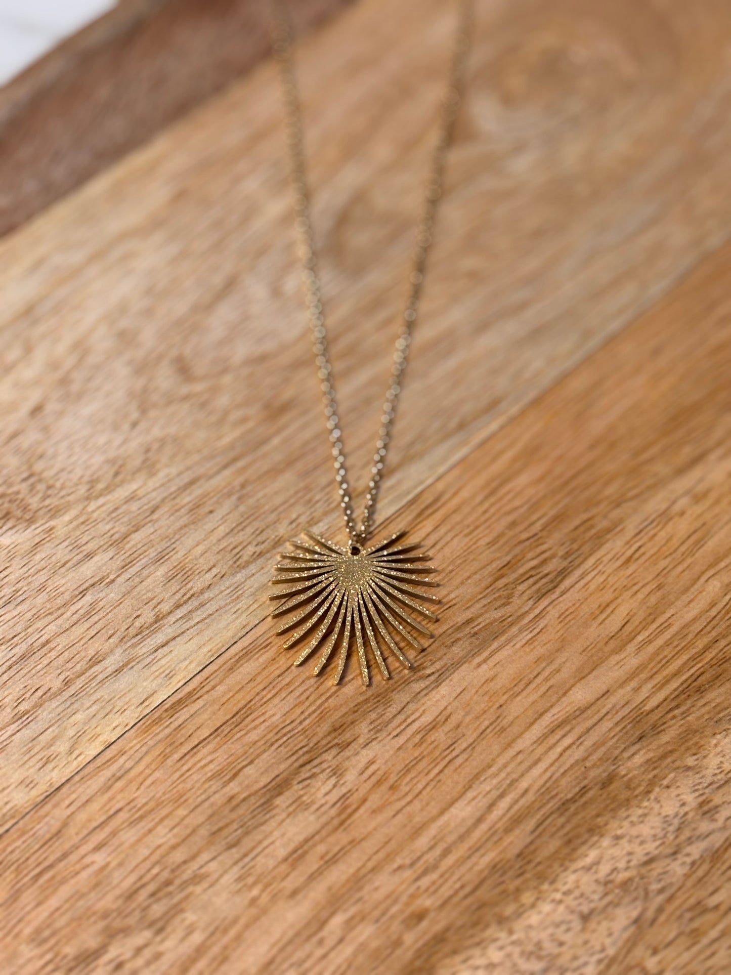 Gold palm leaf necklace