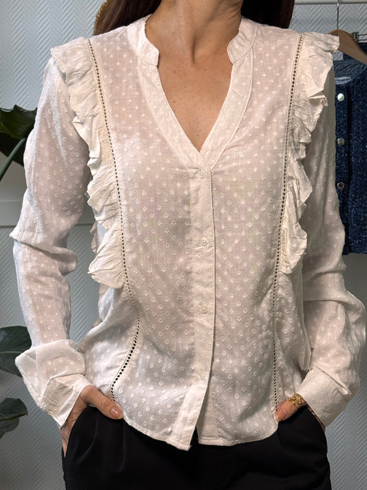 White ruffled blouse