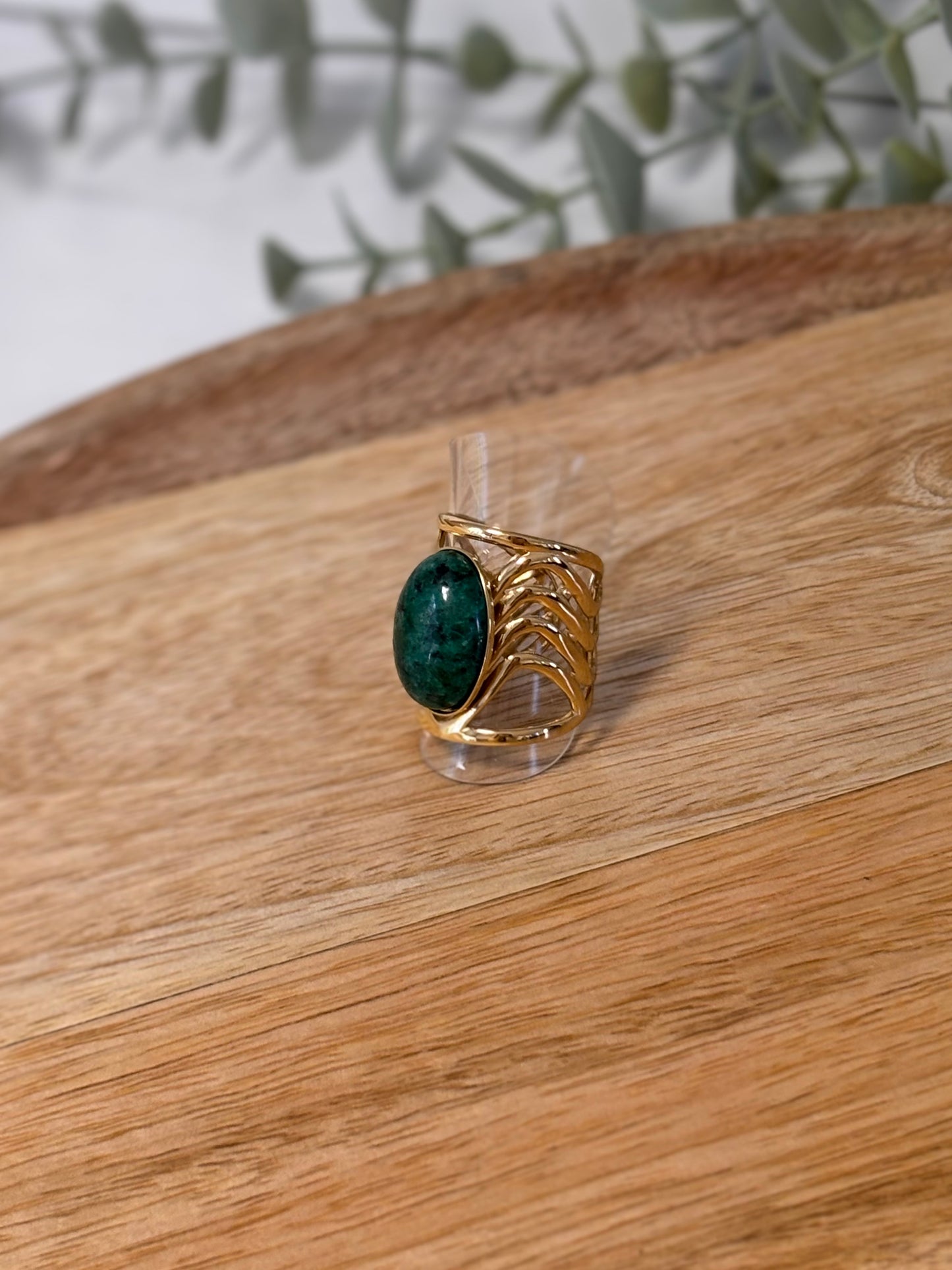 Adjustable gold ring with green stone