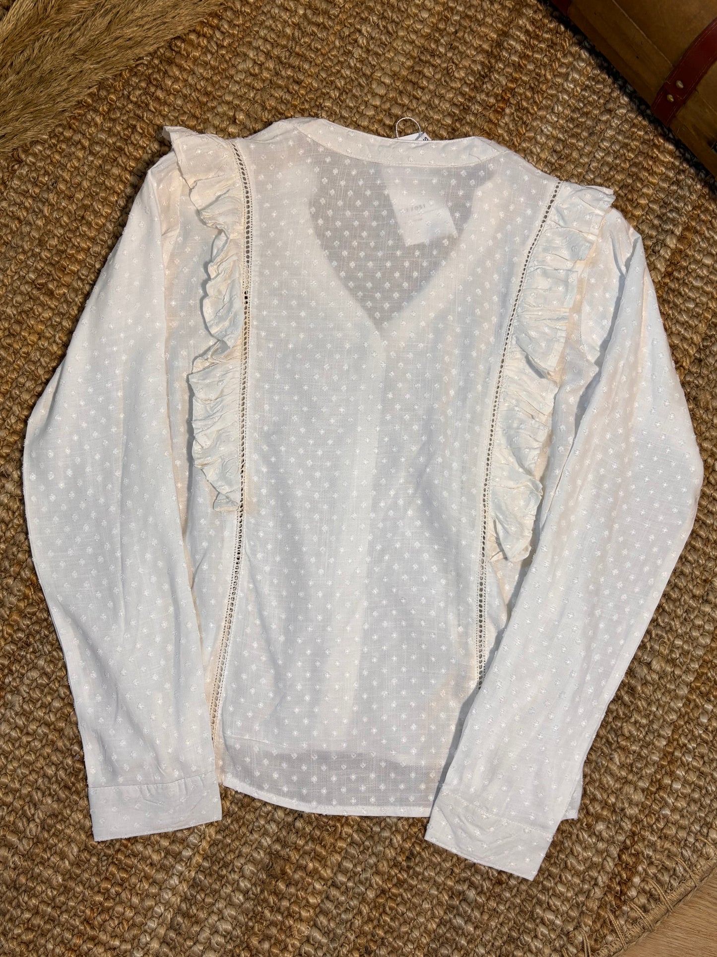 White ruffled blouse