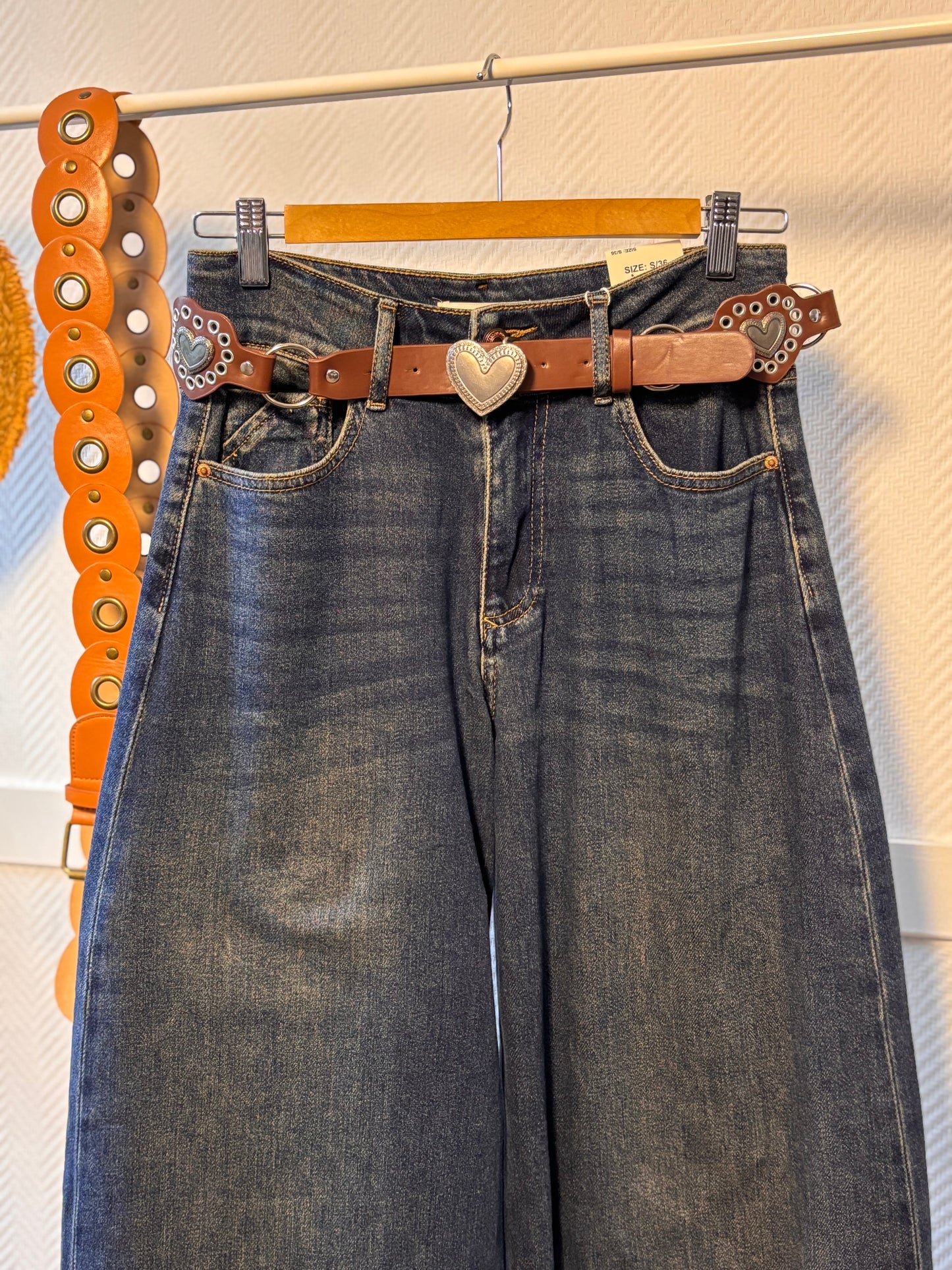 Ultra-wide jeans with heart belt
