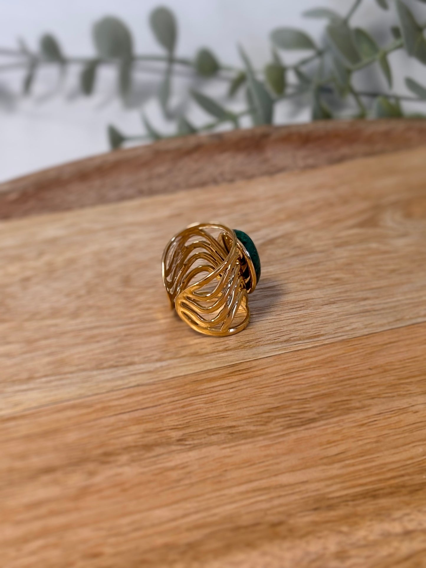 Adjustable gold ring with green stone