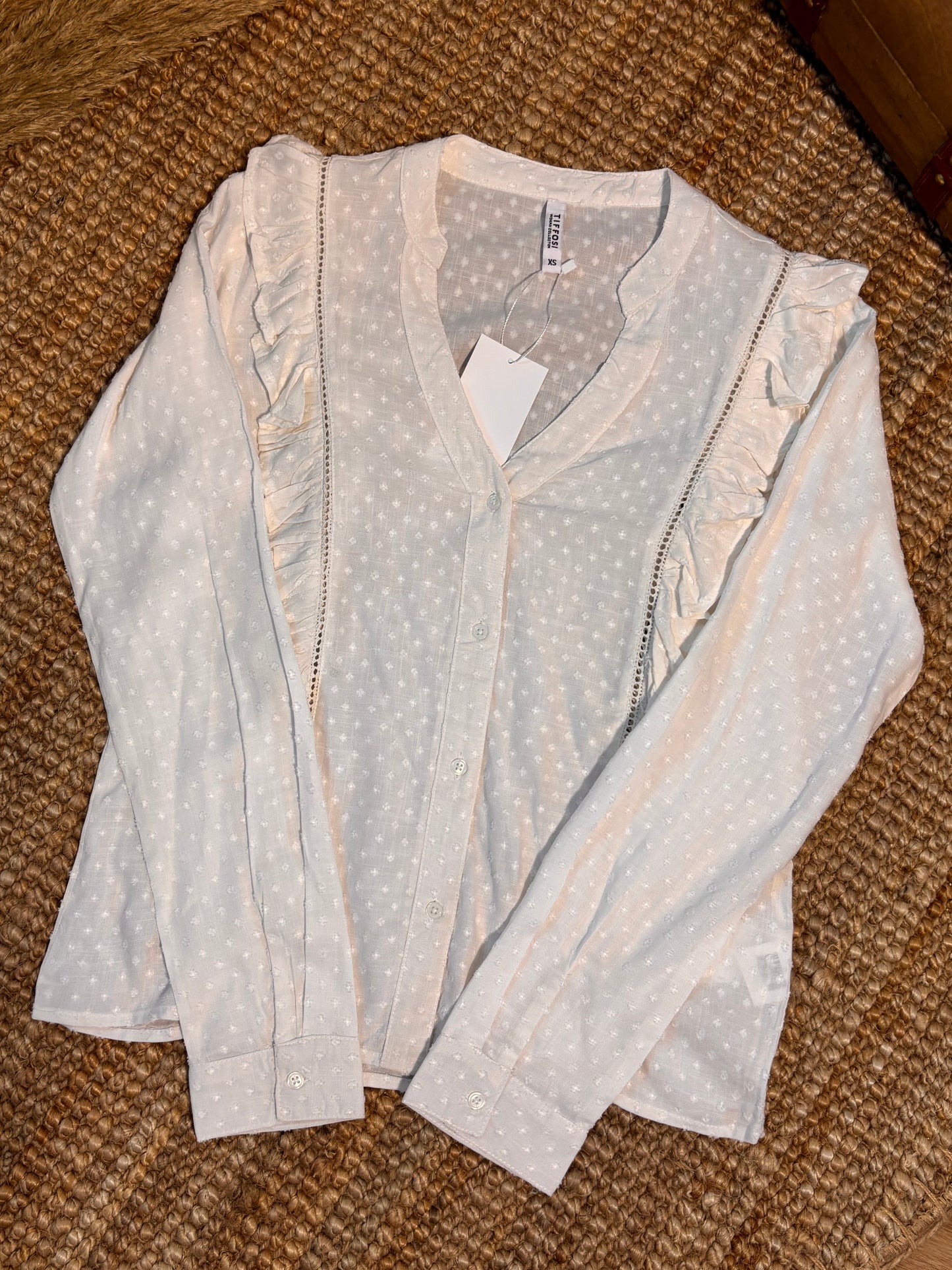 White ruffled blouse